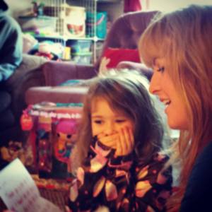 Reading Alice her letter from Santa on Christmas morning